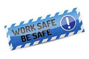 A blue sign saying Work Safe Be Safe in black text with an exclamation point at the end.